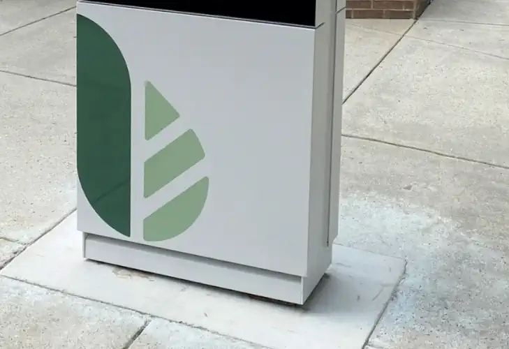 A vinyl label of a green leaf on a display frame