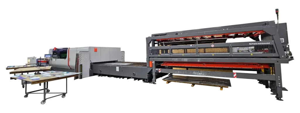 A large table-like machine with extension and 3 tables on rolers