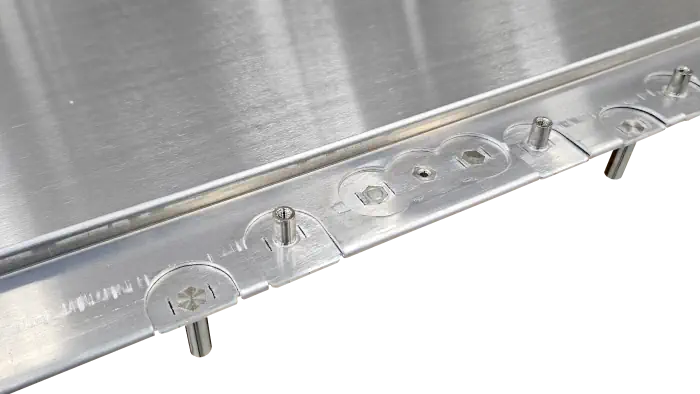 The edge of a sheet of metal that has screw sockets and folds