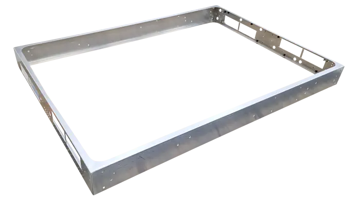 A rectangular metal frame that has sections and holes cut away
