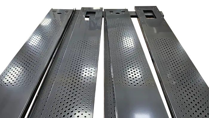 long rectangular metal strips with holes cut away and finished with a dark grey coat