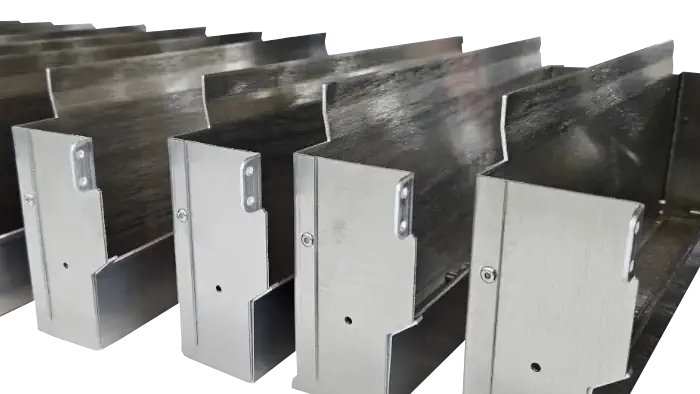 A series of folded metal boxes with cut away holes and flaps