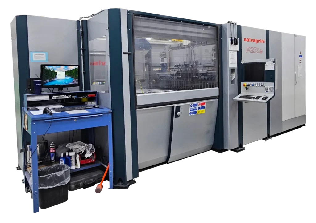 A large machine with two computer terminals for interfacing and a clear window to view internal working mechanism